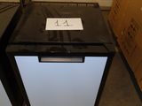 a black and white refrigerator sitting on a pallet in a warehouse