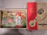 a box full of postage stamps and a box with a teapot