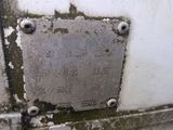 a metal plaque on the side of a white truck