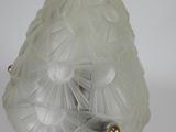 a glass lamp that is sitting on a table