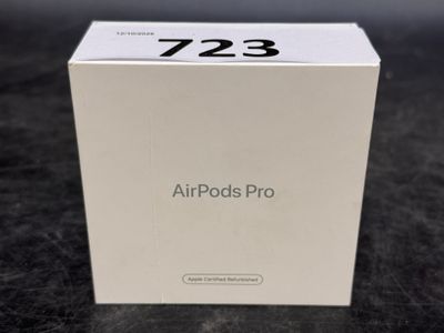 an apple airpods pro box sitting on a table with its lid open