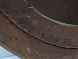 a close up of a metal object with a hole in it