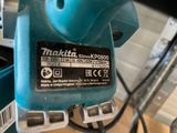 a close up of a blue machine with a label on it