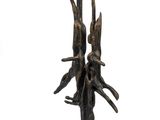 a bronze sculpture of two birds on a tree branch
