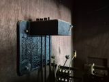 an old typewriter sitting on a desk in a dark room