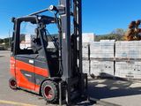 a forklift that is parked in the parking lot