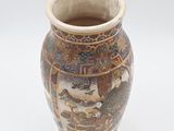 a vase that has a picture of a dragon on it