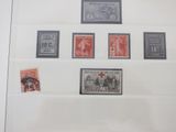 a picture of a collection of stamps in a glass case