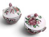 pair of pink and white porcelain sugar and creamers with floral designs