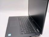 a laptop that is sitting on a white table