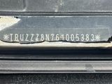 a close up of a car ' s bumper with the word truzzonn on it