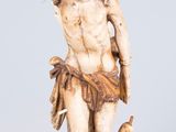 an image of a statue of a man with a bird on his shoulder