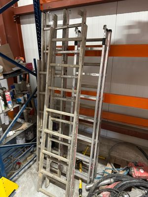 a ladder that is leaning against a wall in a garage
