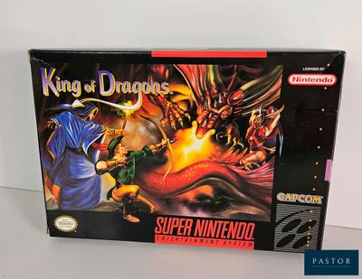 the box for the game king of dragons is sitting on a table