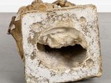 a stone sculpture with a hole in the middle of it