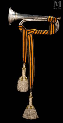 a trumpet with a ribbon around it on a black background