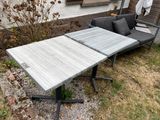 a couch and a table in the yard outside