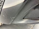 a close up of a car ' s front bumper with scratches