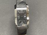 a close up of a wrist watch on a table