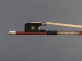 violin bow and bow rest on a gray background