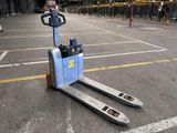 a fork lift truck parked in a parking lot
