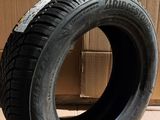 a close up of a tire on a cardboard box on a floor