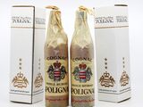 two bottles of wine sitting next to each other in front of a box