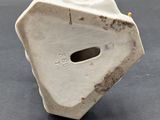 an image of a white vase with a hole in the middle