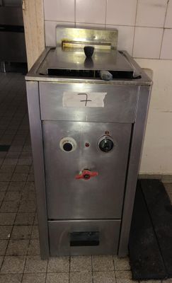 an image of a stainless steel stove with a face on it