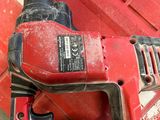 a red tool that is sitting on a red box