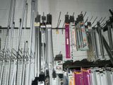 a lot of tools hanging on the wall in the room