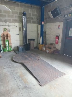 an image of a garage with a lot of stuff in it