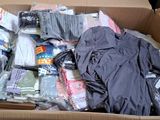 a cardboard box full of clothes and other items