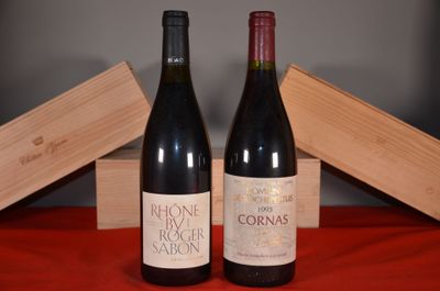 two bottles of wine sitting next to each other on a table