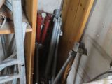 a picture of a room with a bunch of pipes and a ladder