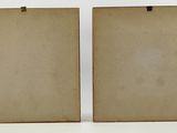pair of antique wooden picture frames with clippings on white background