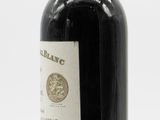 a bottle of wine that is sitting on a table