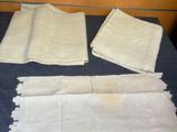 four napkins and two napkins on a table