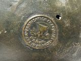 a close up of a metal object with a seal on it