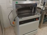 a machine that is sitting in a kitchen next to a counter