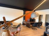 an image of a living room with a desk and a chair