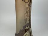a vase that has a picture of a tree on it