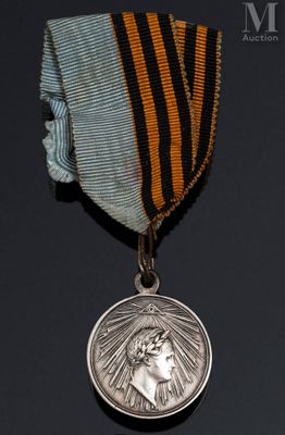 l'image d'une médaille entourée d'un ruban, sur fond noir
