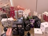 a table with a lot of cosmetics and a mirror