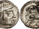a silver coin with a head of a man on it