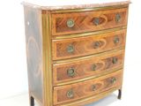 a wooden chest of drawers with brass hardware on it