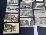 many old photos of a town on display on a table