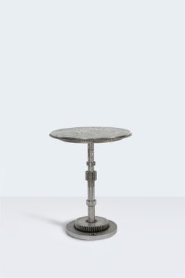 a close up of a small table on a white surface