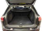the back of a car with the trunk open and the seats down