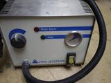 a machine that is sitting on the floor with a hose